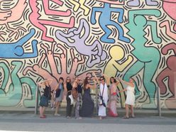 students posing in front of Toto Mundo mural