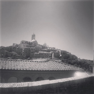 black and white photo of ancient buildings in Siena